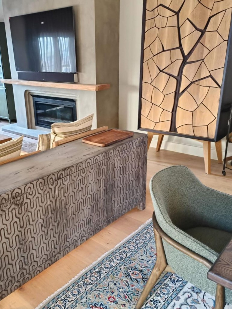 Geometric hardwood cabinet in a living space